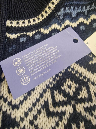 DINTEX-mærke til windbreaker-cardiganen med information om materialet.