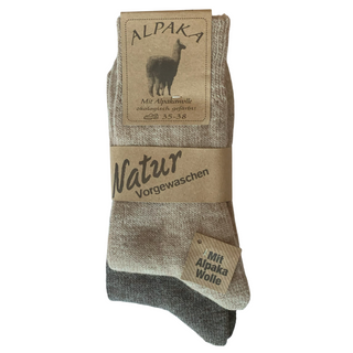 Brune og beige uldsokker med alpaka og ribkant, med produktmærke.