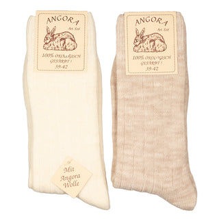 Hvide og beige angorauldsokker med ribkant, med produktmærke.