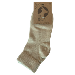 Beige footies med merinould og cashmere, med produktmærke.