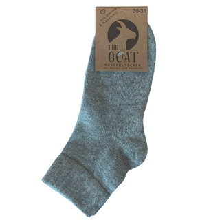 Grå footies med merinould og cashmere, med produktmærke.